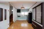 This charming home features a light and airy kitchen with modern appliances and ample cabinet space.