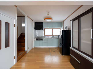 This charming home features a light and airy kitchen with modern appliances and ample cabinet space.