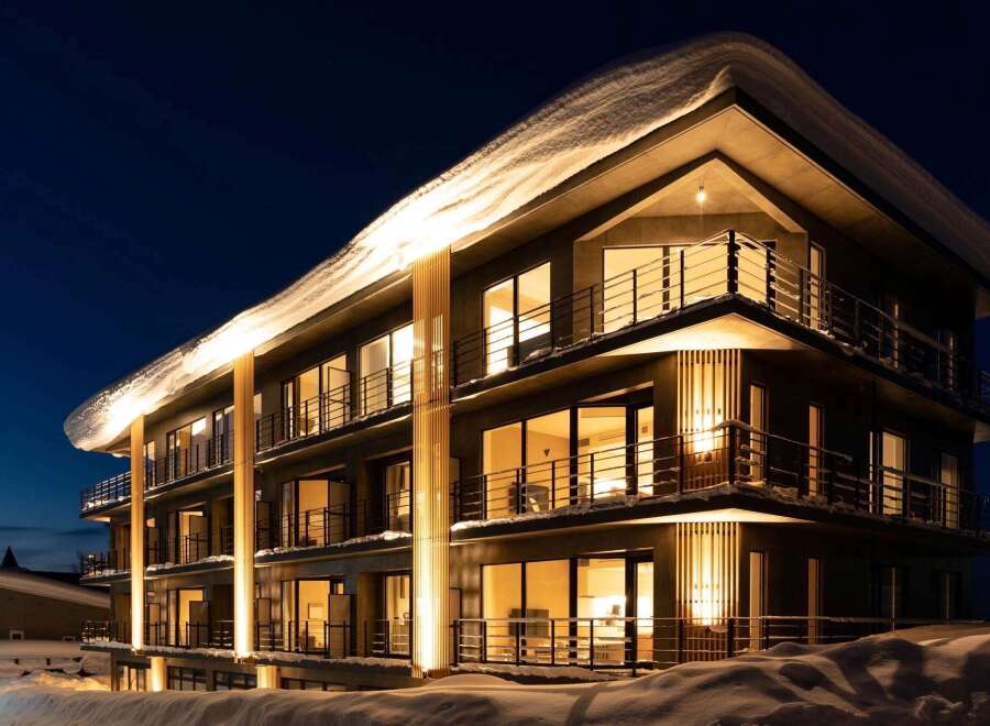 Experience luxurious lodging in this stunning snow-covered hotel.