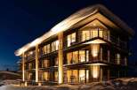 Experience luxurious lodging in this stunning snow-covered hotel.