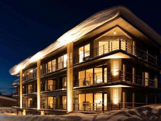 Experience luxurious lodging in this stunning snow-covered hotel.