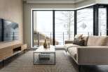 Modern living room with floor-to-ceiling windows offering stunning views of a snowy landscape.