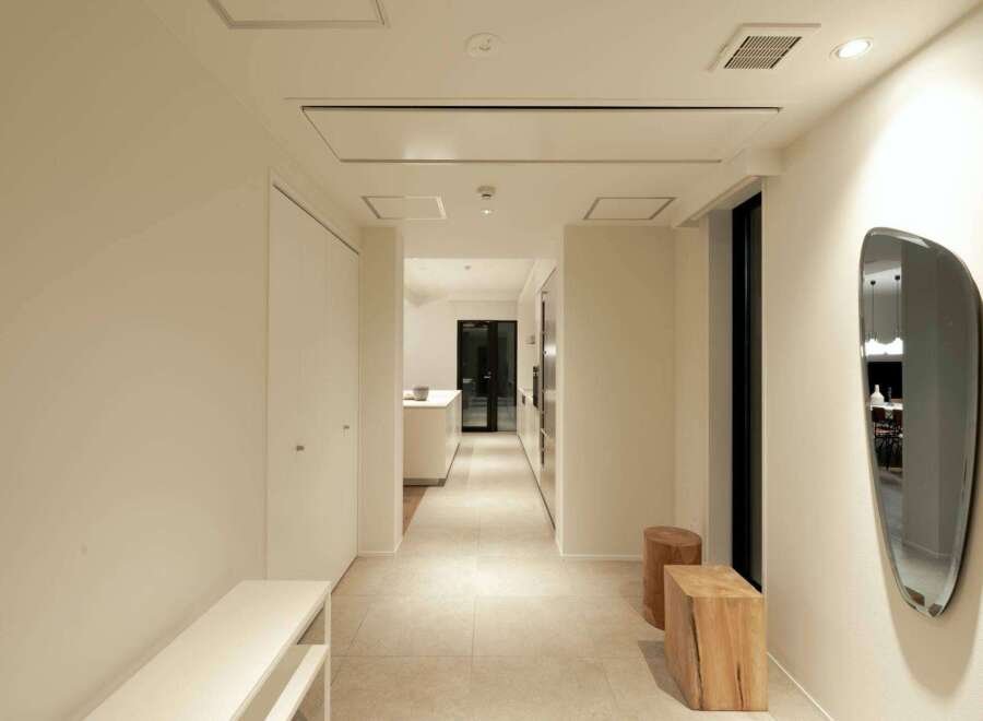 This stunning hallway boasts a minimalist design with clean lines and neutral colors.