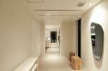 This stunning hallway boasts a minimalist design with clean lines and neutral colors.