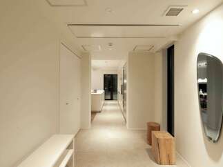 This stunning hallway boasts a minimalist design with clean lines and neutral colors.