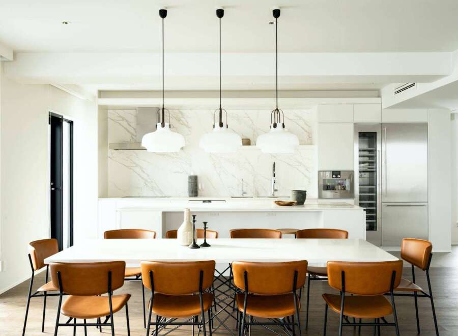 This stunning property boasts a sleek, modern kitchen with marble countertops and high-end stainless steel appliances.