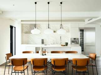 This stunning property boasts a sleek, modern kitchen with marble countertops and high-end stainless steel appliances.