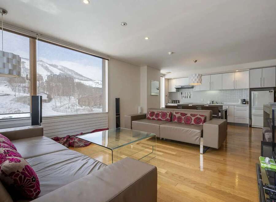 This stunning condo boasts breathtaking mountain views from its large windows, creating a serene and relaxing atmosphere.