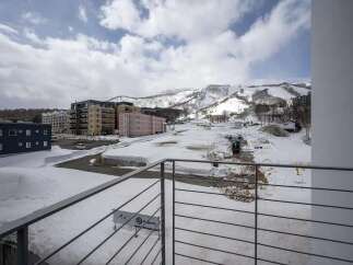 Luxury apartments with breathtaking views of snow-capped mountains and ski slopes.