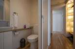 Modern and minimalist bathroom with a sleek toilet and sink.
