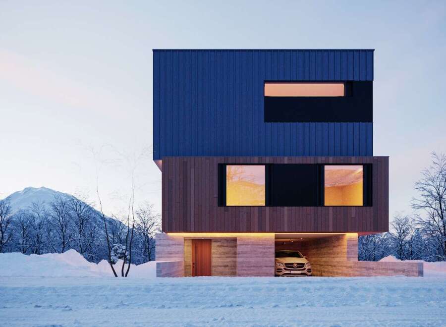 Stunning modern home nestled in a snowy landscape, featuring a sleek blue and wood exterior.