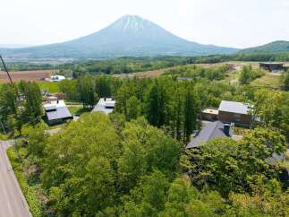 Nestled in a serene forest setting with breathtaking views of a majestic mountain, this property offers an idyllic escape.