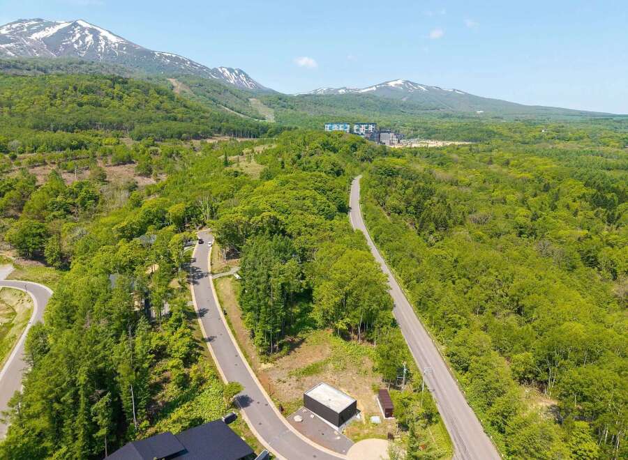 Mountainside lot with stunning views and easy access to resort amenities.