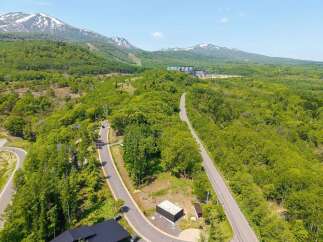 Mountainside lot with stunning views and easy access to resort amenities.