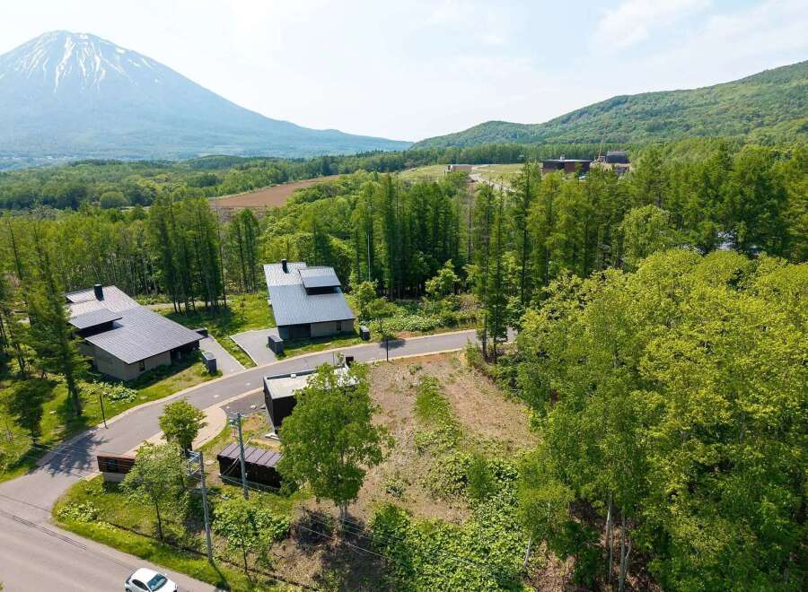 Mountain views and serene forest surroundings enhance this stunning property.
