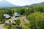 Mountain views and serene forest surroundings enhance this stunning property.