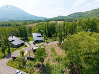 Mountain views and serene forest surroundings enhance this stunning property.