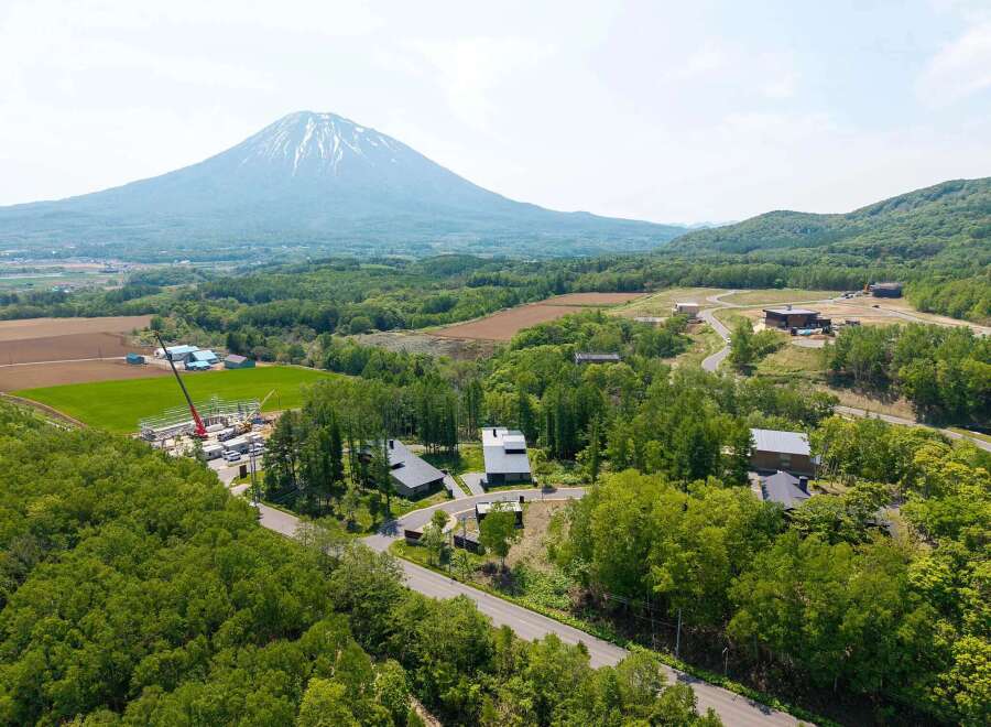 Nestled in a serene landscape, this property offers breathtaking views of a majestic mountain.