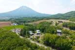 Nestled in a serene landscape, this property offers breathtaking views of a majestic mountain.