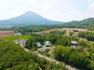 Nestled in a serene landscape, this property offers breathtaking views of a majestic mountain.