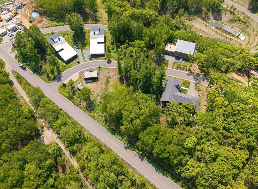 Nestled in a lush forest, this secluded property offers a tranquil escape with modern homes.