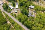 Nestled in a lush forest, this secluded property offers a tranquil escape with modern homes.