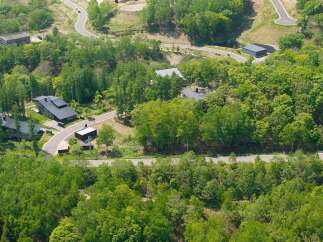 Nestled in a lush forest, this secluded property offers a tranquil escape.