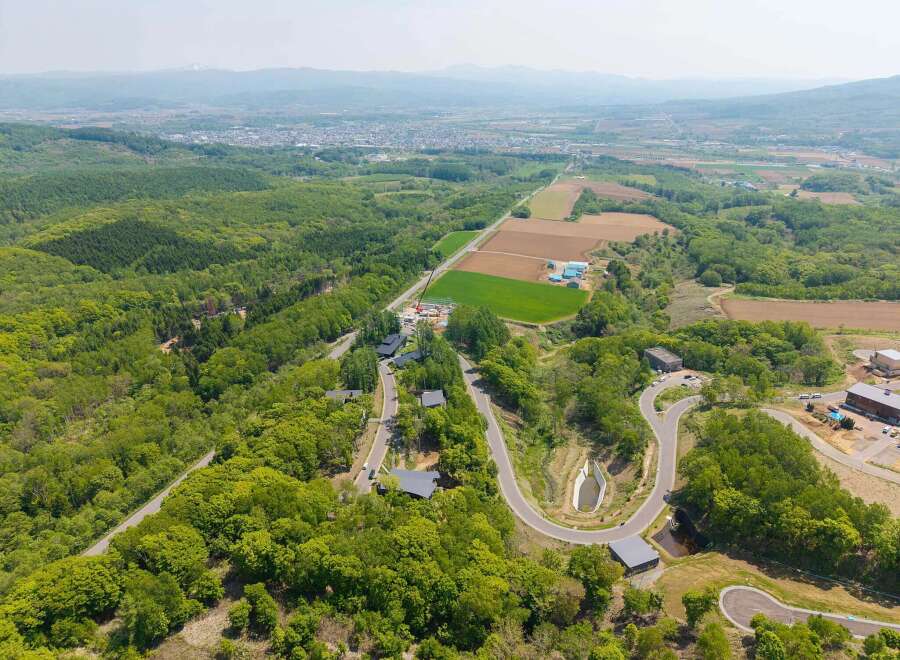 Nestled in a serene landscape, this property boasts stunning views and a unique road system.