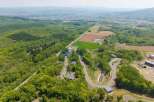 Nestled in a serene landscape, this property boasts stunning views and a unique road system.