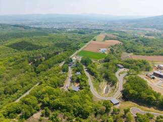 Nestled in a serene landscape, this property boasts stunning views and a unique road system.