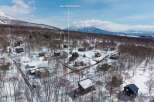 Mountain View Lot in the Snow: This secluded lot offers breathtaking views of majestic snow-capped mountains.