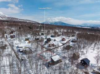 Mountain View Lot in the Snow: This secluded lot offers breathtaking views of majestic snow-capped mountains.