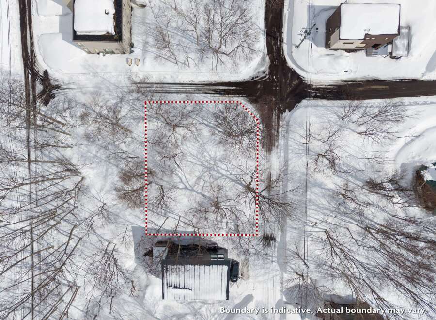 Discover this expansive lot nestled amidst a serene winter landscape.