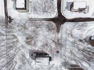 Discover this expansive lot nestled amidst a serene winter landscape.