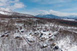 Nestled in a snowy landscape, this charming winter village offers a serene escape.