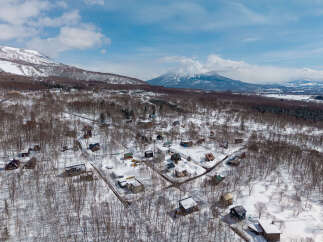 Nestled in a snowy landscape, this charming winter village offers a serene escape.
