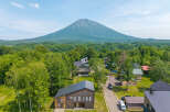 Nestled in a serene forest setting with breathtaking mountain views, this stunning property offers a tranquil escape.
