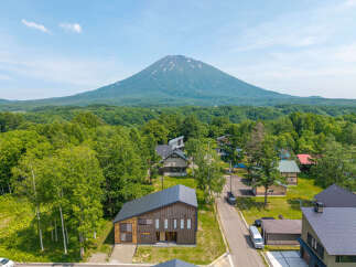 Nestled in a serene forest setting with breathtaking mountain views, this stunning property offers a tranquil escape.