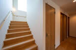 This stunning property boasts a beautiful wooden staircase, leading to more living space.