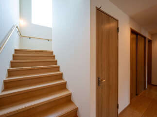 This stunning property boasts a beautiful wooden staircase, leading to more living space.