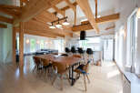 Stunning modern home with exposed wooden beams and high ceilings.