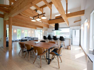 Stunning modern home with exposed wooden beams and high ceilings.