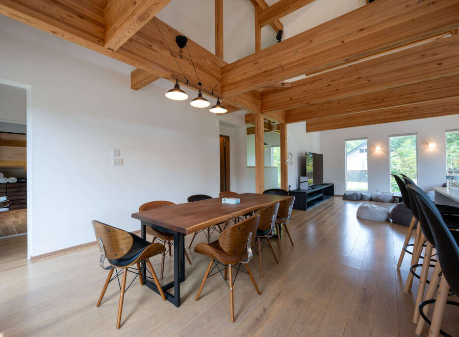 Stunning modern home with exposed wooden beams and high ceilings.