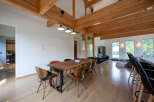 Stunning modern home with exposed wooden beams and high ceilings.