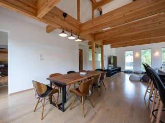 Stunning modern home with exposed wooden beams and high ceilings.