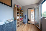 This stunning property boasts a dedicated playroom, complete with built-in shelving for games and toys.