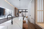 Stunning modern kitchen with marble countertops and a sleek island, perfect for entertaining.