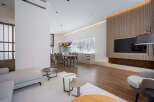 Stunning modern living space with open floor plan, seamlessly connecting the kitchen and living room.