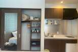 This cozy studio apartment boasts a built-in wardrobe with ample storage, a kitchenette equipped with essential appliances, and a comfortable sleeping area.
