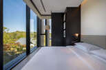 Wake up to breathtaking views from this luxurious hotel room.